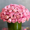 A beautiful and simplistic accent of Tulips arranged within a cylinder glass