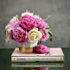 Peonies layered over delicate leaves ready for same day delivery. let our