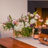 Delight in the enchanting beauty of our Floral Harmony arrangement, gracefully showcased
