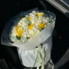 bouquet of white hydrangea ranunculus and daffodils
