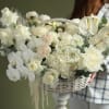 white composition with orchids, hydrangeas, dianthus, spray roses