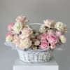 delicate basket of spray roses and dianthus