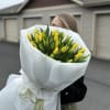 a bouquet of forty delicate yellow tulips