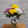 Marvelously cheerful design of bright colorful daisies featured in a petite vase.

Approximately
