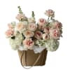 Delicately scented flowers on a stylish bag

