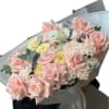 Fresh bouquet of pink-cream roses, dianthus, diluted with yellow roses and eucalyptus
