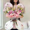 This charming butterfly-shaped bouquet features a delightful blend of 3 pink lilies