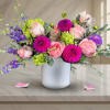 Bold and joyful, this striking arrangement bursts with color and energy, combining