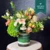 A fresh burst of spring, this elegant arrangement is heartfelt tribute to
