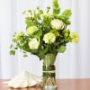 Embrace the beauty of green with this stunning floral piece, perfect for