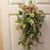 Lush with a variety of faux blooms, our Farmhouse Floral Door Swag