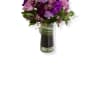 Vases of purple roses and seasonal flowers 