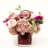 THIS LOVELY PINK ARRANGEMENT HAS GARDEN ROSES, HYDRANGEA, ANENOME, LISIANTHUS, AND WHITE