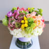 beautiful soft collection of spring blooms, such as hydrangeas, roses, tulips, ranunculus