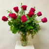 Hot Pink Dozen Roses and Greenery Arranged in a Glass Vase.
