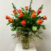 Orange Dozen Roses with Greenery Arranged in Glass Vase.