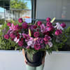 Our biggest arrangement with Pink lilies, purple roses, purple chrysanthemums, pink chrysanthemums
