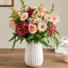 This blush-colored gathering features hints of peach and pink, along with accents