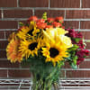 SUNFLOWERS, ORANGE AND YELLOW ROSES, GERBER DAISIES IN A VASE