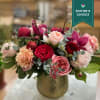 An absolutely stunning fresh flower arrangement full of premium and garden roses