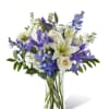 Our Calming Comfort Bouquet is crafted with iris, lilies, stock and delphinium.