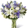 Our Calming Comfort Bouquet is crafted with iris, lilies, stock and delphinium.