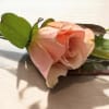 A custom boutonniere is a uniquely crafted floral accessory designed to complement