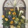 Yellow color pallet of flowers with tropical touch in ceramic vase, and