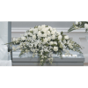 Casket spray with all white flowers including roses and dendrobium orchids