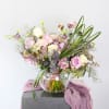 A romantic Lavender and Ivory fragrant garden rose with seasonal bloom with