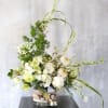 An elegant luxury arrangement with all precious ivory bloom, such as garden