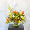 A cheerful Orange, yellow and Ivory Tulip combination handtie bouquet. This arrangement