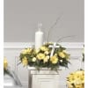 candle pedestal arrangement with yellow miniature carnations, yellow daisy poms and soligado-