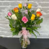 Beautiful assortment of different colored long stemmed roses. (Colors will vary -