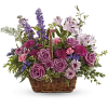 This lush lavender rose arrangement is a basket of beauty to brighten