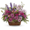 This lush lavender rose arrangement is a basket of beauty to brighten