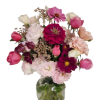 This is a bouquet of mixed summer flowers like lisianthus,, roses, zinnias