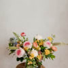 Soft Embrace features a graceful mix of seasonal blooms in soft pinks
