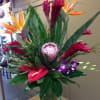 A lush and lovely selection of fresh tropicals artfully arranged in a
