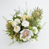 A Delicious arrangement of heavenly white lisianthus thistle and glorious cymbidium orchid.