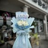 A wrapped bouquet of flowers is a beautifully arranged collection of blooms
