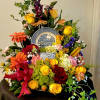 This arrangement is a bright and colorful design with a collection of