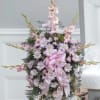 Standing Spray with lavender daisy poms, pink gladiolas and pink mini carnations