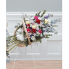 Fireside Basket Standing Spray with stargazer lilies, carnations, roses, delphinium, daisies, statice