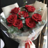 one dozen of red Roses, with some eucalyptus in a beautiful wrapping