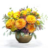 Gorgeous and elegant floral arrangement in a short vase  