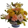 Peach dahlias, yellow garden roses, yellow orchids, pink lisianthus and pink peonies