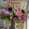 This arrangement is uniquely crafted and inspired by our love for daisies.