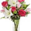 Boasting a fresh from the garden look, this arrangement of fuchsia roses