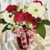 Pretty and colorful arrangement of reds, pinks, and white in a beautiful